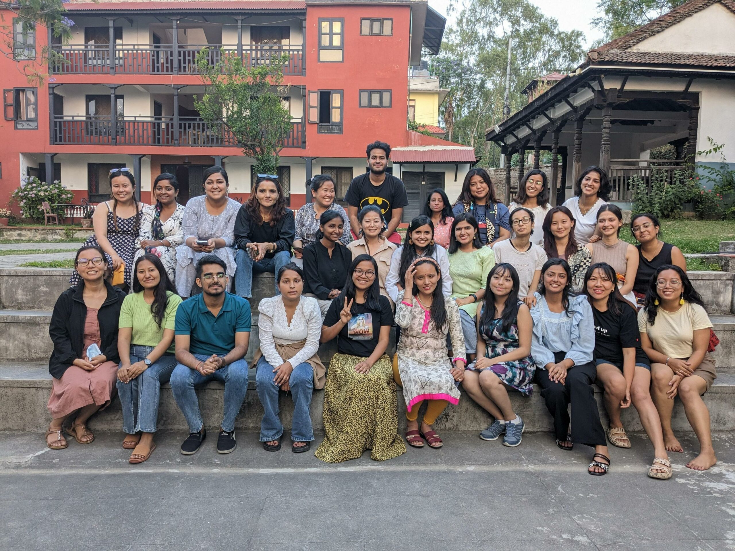 group of participants of FTX 2023 (group 2) smiling at the camera. There are 26 people in the photo